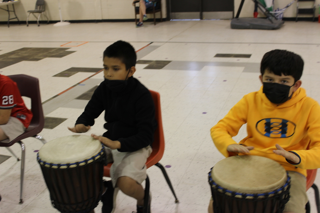 Students  playing drums.