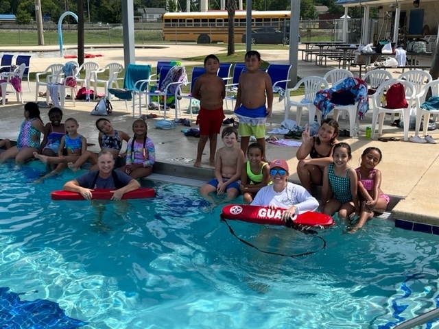 Students learning swimming safety.